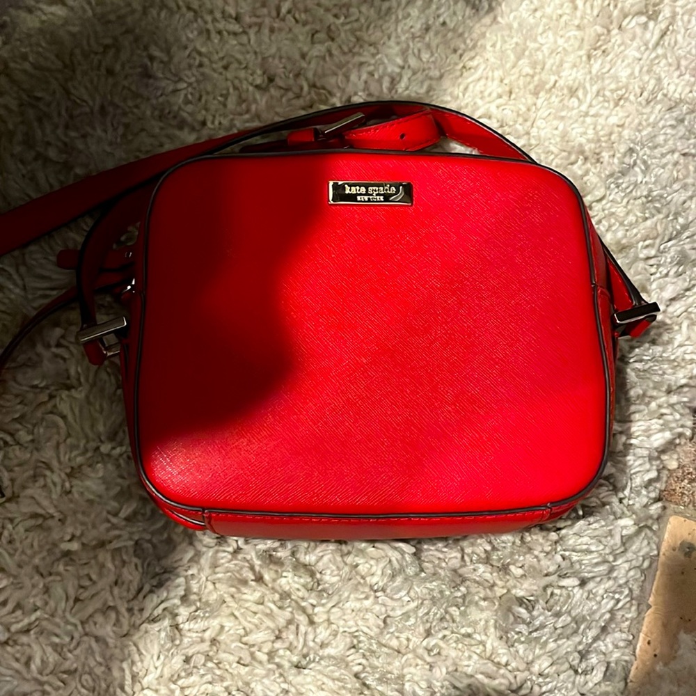 Cherry red Kate Spade camera bag.